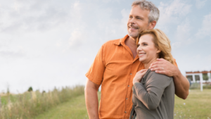 Couple hugging whilst thinking about updating their Will