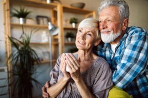 Couple hugging whilst thinking about making a Lasting Power of Attorney